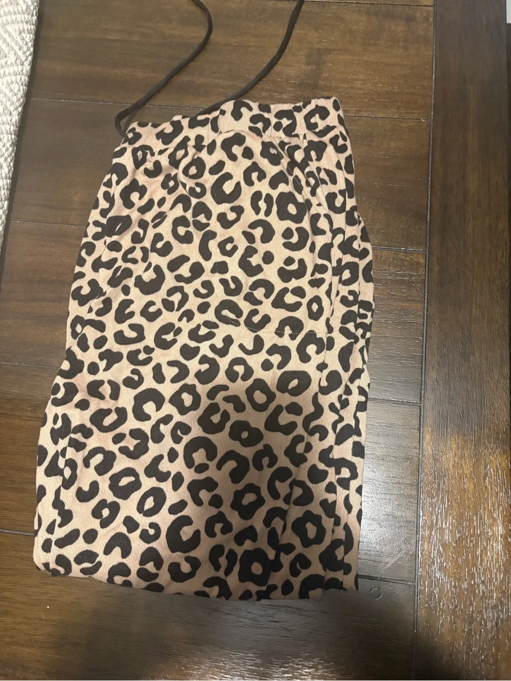 Woman Kate Spade Leopard Print pajamas.